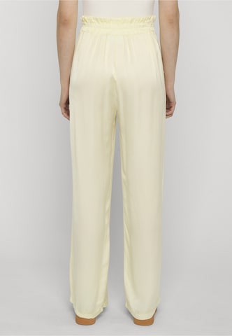 Estelou - Loosefit Pantalón 'Flowing' en amarillo