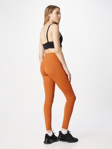 NIKE Skinny Športové nohavice 'One' - oranžová