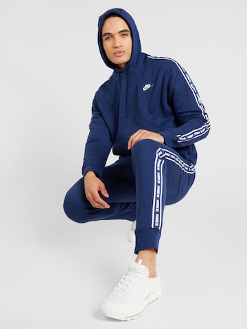 Nike Sportswear Joggingpak 'CLUB FLEECE' in Blauw