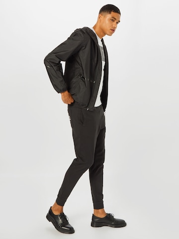 Tapered Pantaloni de la EA7 Emporio Armani pe negru