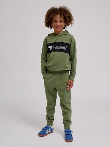 Hummel Tapered Sports trousers in Green