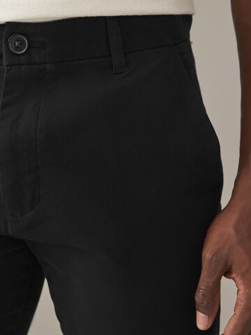 Next Slimfit Chinobyxa i grå