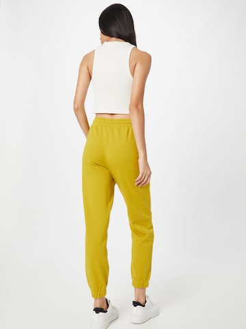 DRYKORN - Tapered Pantalón 'ONCE' en amarillo