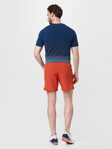 UNDER ARMOUR Regular Sportbroek 'SpeedPocket' in Oranje