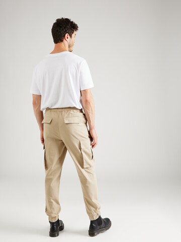 ABOUT YOU x Jaime Lorente Tapered Hose  'Adriano' in Beige