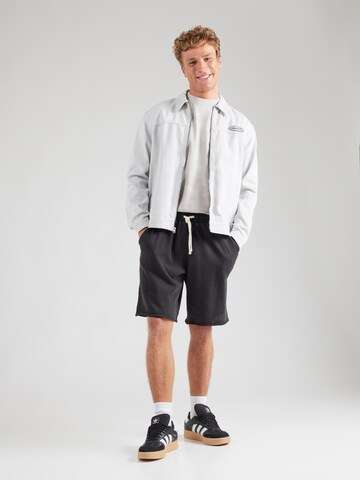 Largi Pantaloni sport 'TREVOR' de la ELLESSE pe negru