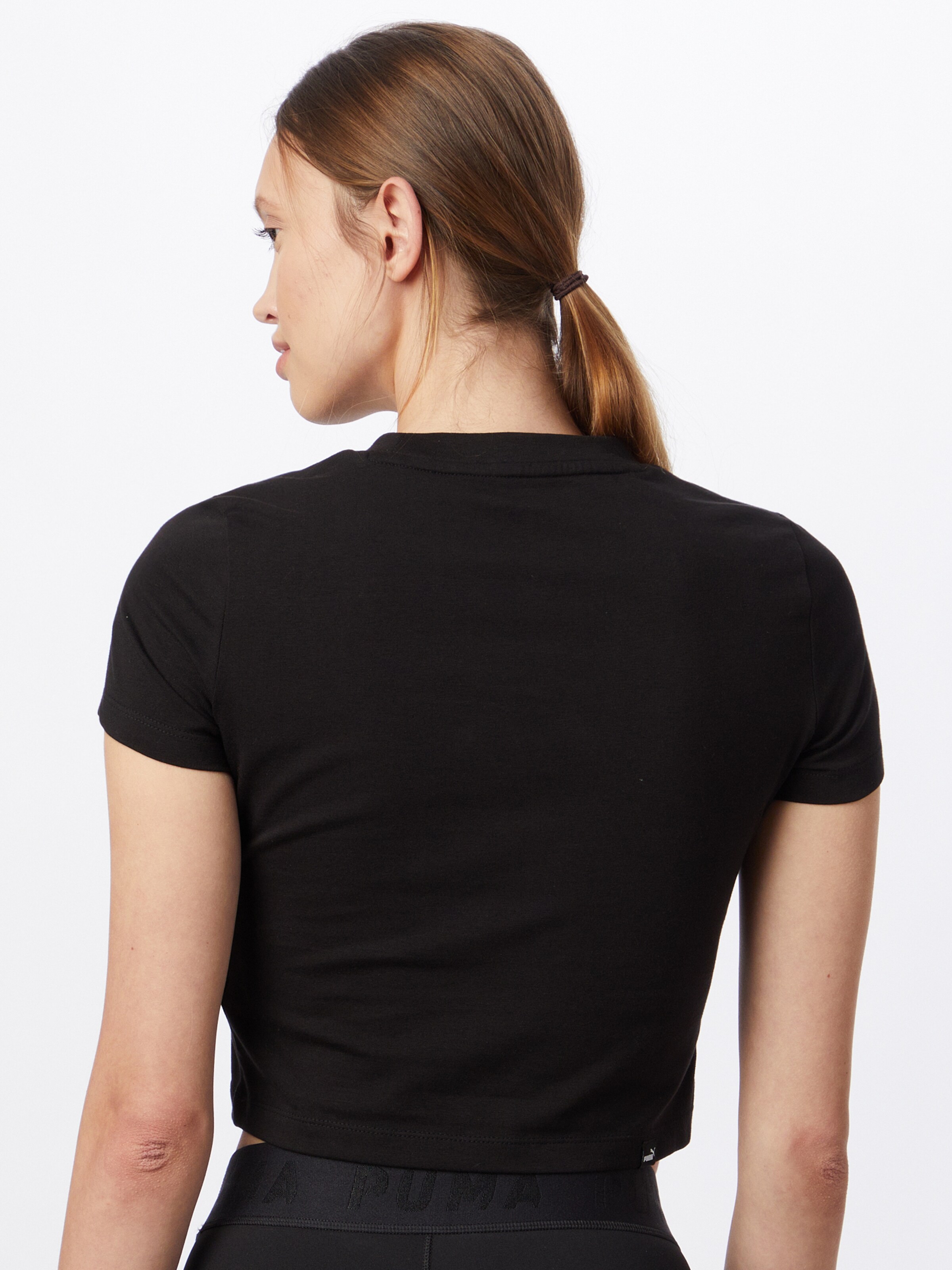 Femme T-shirt fonctionnel PUMA en Noir 