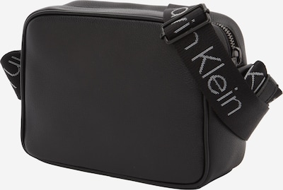 Rankinė su ilgu dirželiu iš Calvin Klein, spalva – juoda / balkšva, Prekių apžvalga