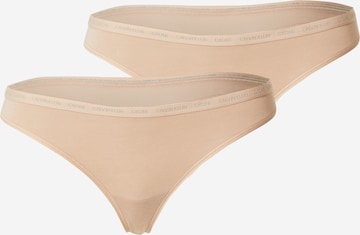 Tanga de la Calvin Klein Underwear pe bej: față