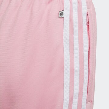 ADIDAS ORIGINALS Zwężany krój Spodnie w kolorze różowy