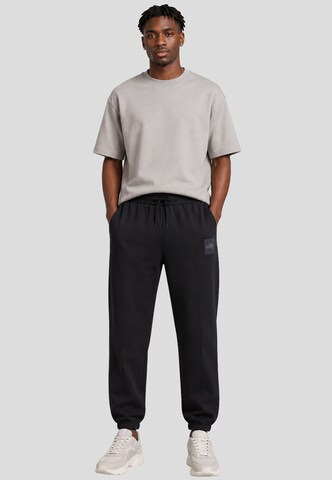 UMBRO - Tapered Pantalón en gris