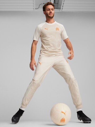 PUMA Slimfit Sportbroek 'OM Prematch' in Beige