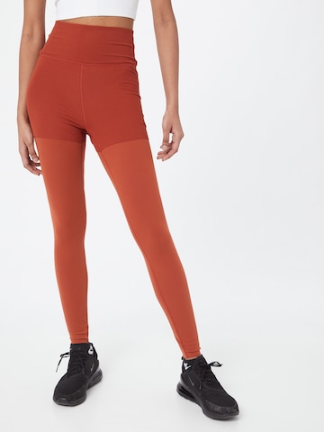 Skinny Pantalon de sport NIKE en orange : devant