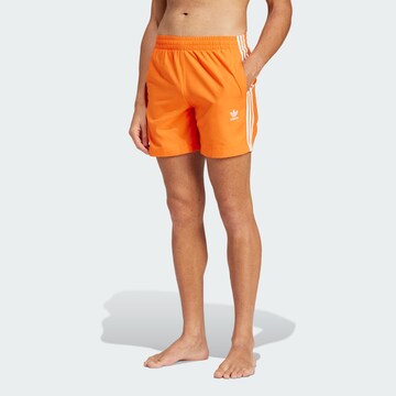 ADIDAS ORIGINALS Swimming shorts in Orange: front