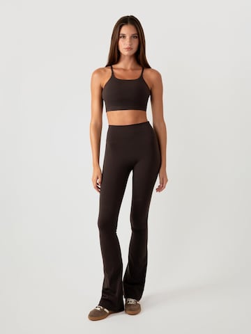 YO-GAYA Flared Leggings in Brown: front