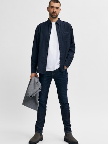 Coupe slim Jean 'Leon' SELECTED HOMME en bleu