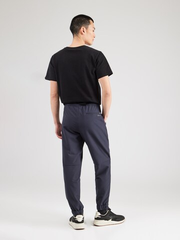 BOSS - Tapered Pantalón 'T_Flex' en azul
