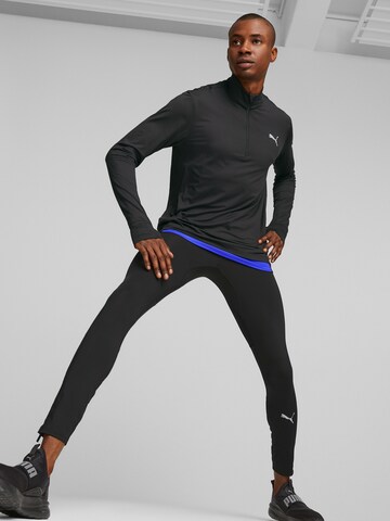 PUMA Skinny Workout Pants in Black: front