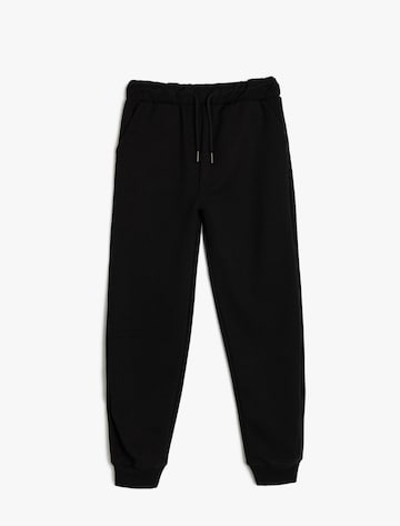 Koton Tapered Trousers in Black: front