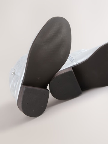 Next - Botas en plata