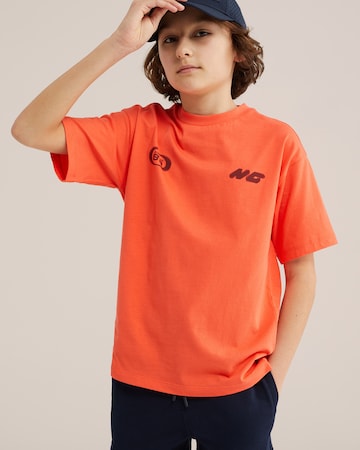 T-Shirt WE Fashion en orange : devant