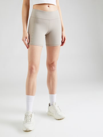 Skinny Pantaloni sportivi di Reebok in beige: frontale