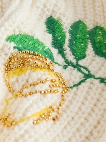 Next Neuletakki värissä beige