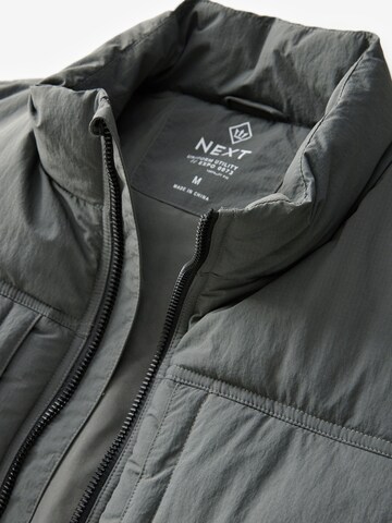 Next - Chaleco en gris