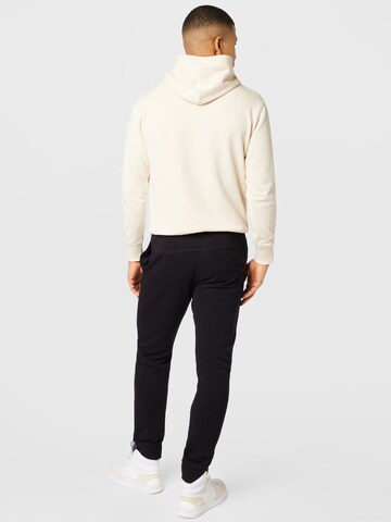 Champion Authentic Athletic Apparel Tapered Broek in Zwart