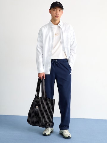 Nike Sportswear Lużny krój Spodnie 'CLUB' w kolorze niebieski