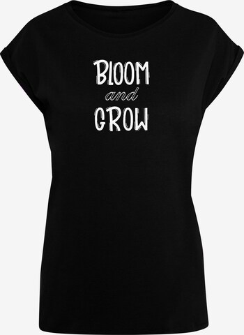 Merchcode T-Shirt 'Spring - Bloom And Grow' in Schwarz: predná strana