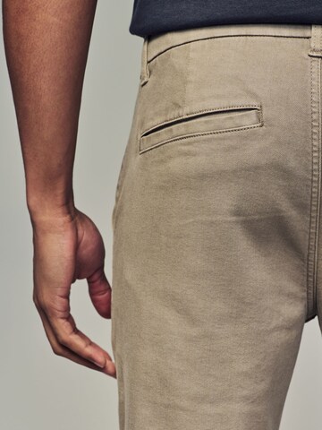 Slimfit Pantaloni chino di Next in beige