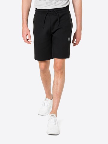 Regular Pantaloni sport de la Superdry pe negru: față