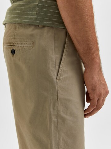 Regular Pantaloni eleganți de la SELECTED HOMME pe bej