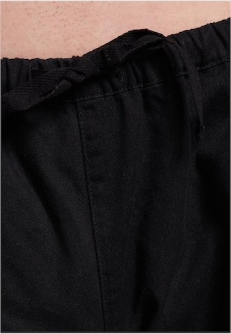 Loosefit Pantaloni di Karl Kani in nero