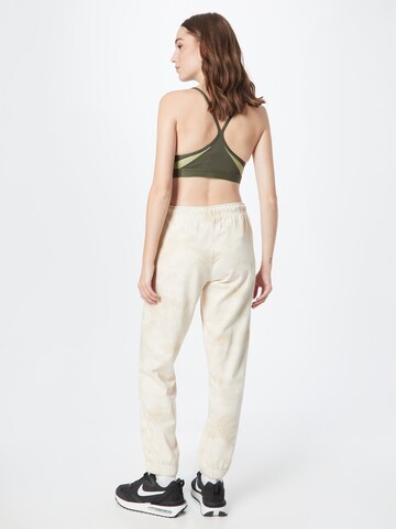 Effilé Pantalon Nike Sportswear en beige