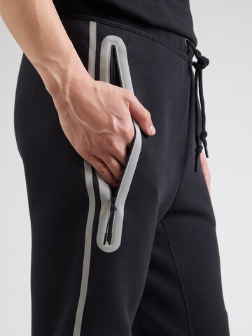 Nike Sportswear Tapered Trousers in Black