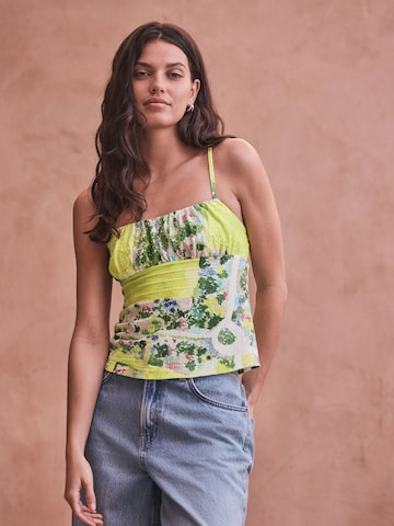 Next - Top en verde: frente