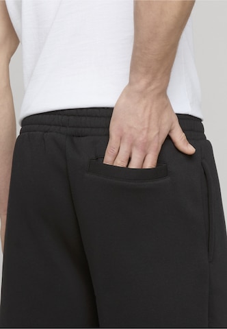 Karl Kani Regular Trousers in Black