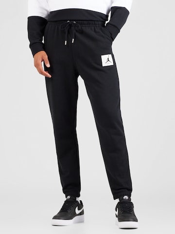 Tapered Pantaloni 'ESS' de la Jordan pe negru: față