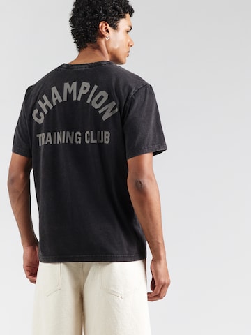 Champion Authentic Athletic Apparel - Camiseta en negro: frente