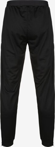 Effilé Pantalon de sport JAKO en noir