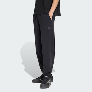 ADIDAS SPORTSWEAR Широка кройка Спортен панталон в черно: отпред
