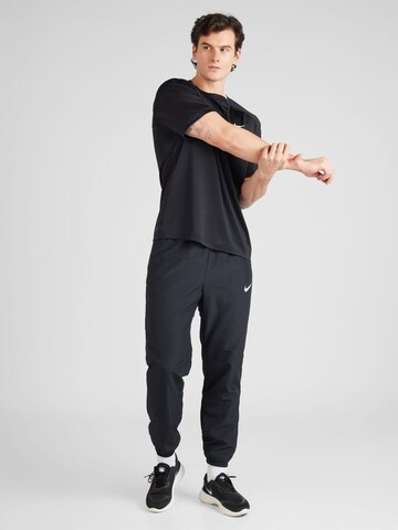 Effilé Pantalon de sport 'Academy' NIKE en noir