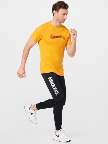 NIKE Tapered Sports trousers 'FC Libero' in Black