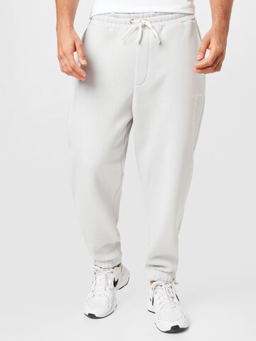 BURTON MENSWEAR LONDON Tapered Pants in Grey: front
