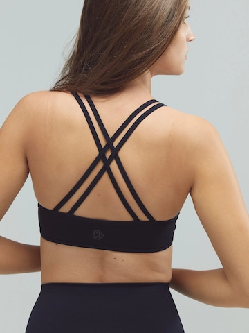 Bustino Reggiseno sportivo 'ACTIVE X-Strap Bra' di DRILLS Apparel in nero