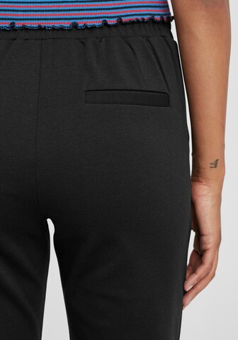 Oxmo - Tapered Calças 'Anita' em preto