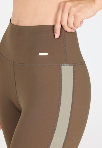 Athlecia Skinny Sports trousers 'Aspasia' in Brown