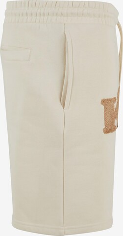 Karl Kani Regular Pants in Beige